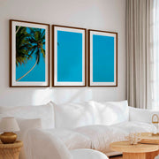 Set of 3 Wall Art – Tropical Palm Trees and Calm Blue Sea - Dark Brown Framed Poster with White Border - Artworksets