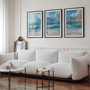 Sunny Beach Triptych with Gentle Waves and Distant Mountains - Black Framed Poster with White Border - Artworksets