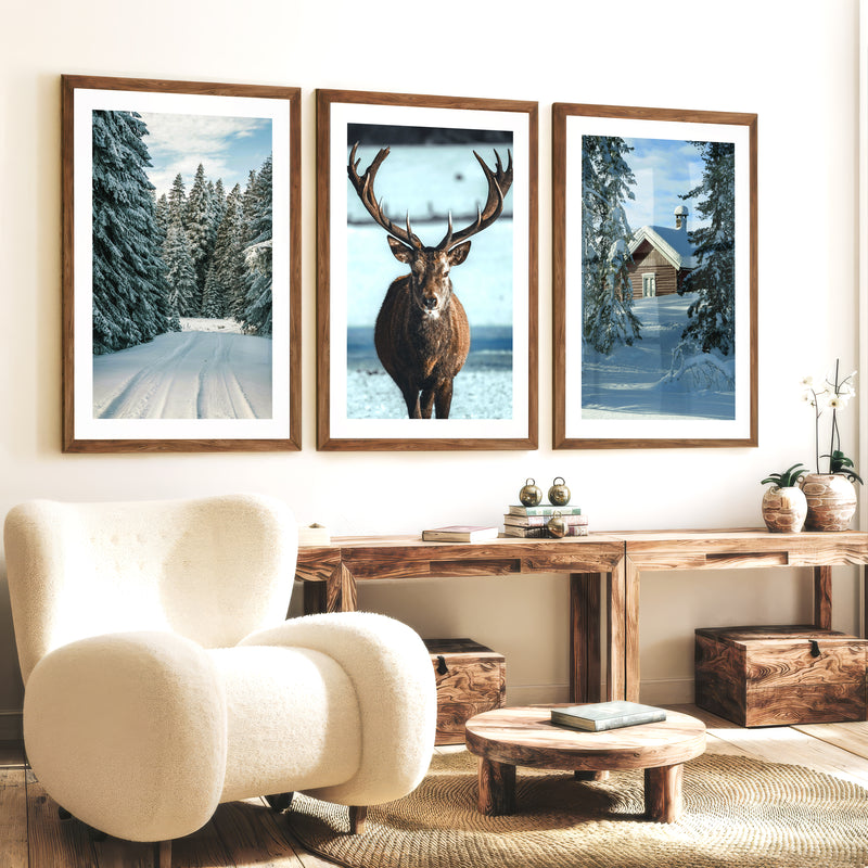 Winter Scene Wall Art – Snowy Forest, Deer & Cabin - Dark Brown Framed Poster with White Border - Artworksets